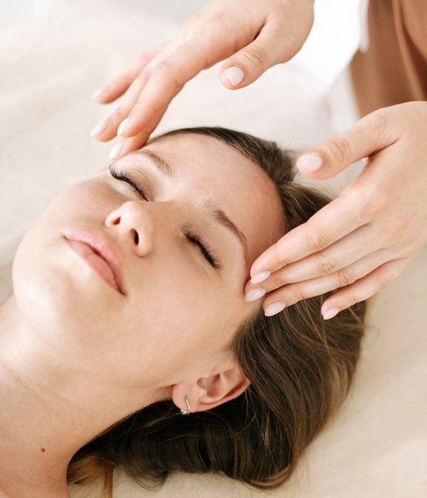 Woman with closed eyes looks relaxed and calm.